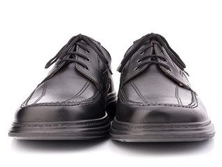 Black glossy man’s shoes with shoelaces