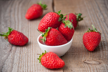 close up of strawberry on wooden background 