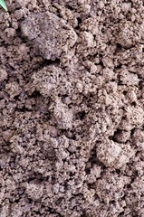 Macro closeup of dirt ground background detail.