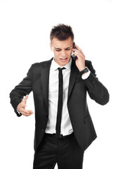 Young businessman screams in telephone