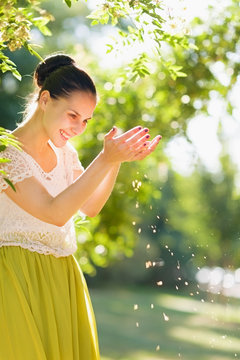 Young Woman Let Wind Sowing Seeds