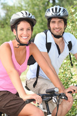 Couple riding bikes