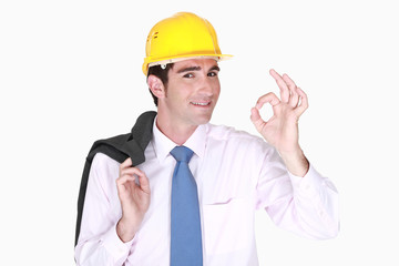 handsome smiling architect making okay sign