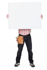 Man covering his face with a blank sign