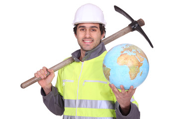 Construction worker holding a glove and pickaxe