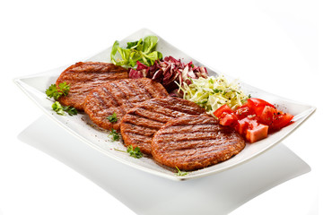 Grilled steaks and vegetables