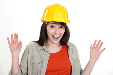 Happy brunette builder waving hands