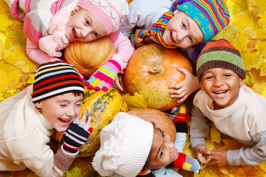 Kids on yellow leaves