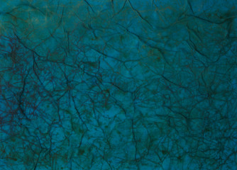 Paper with blue and black paint abstract