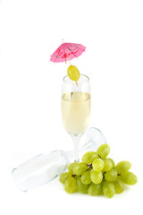 A glass of white wine and empty glass