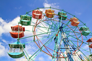 ferris wheel against a blue sky