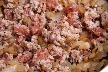 Minced meat and onion being fried on a pan