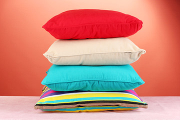 pillows on red background © Africa Studio