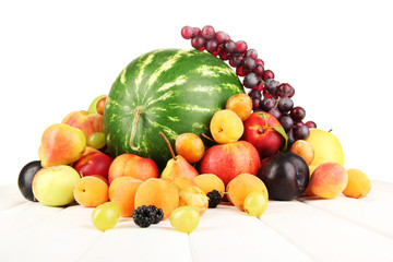 Still life of fruit on wooden table isolated on white