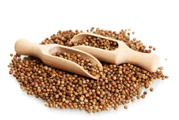 Poster Heap coriander seeds in wooden spoon isolated on white © Africa Studio