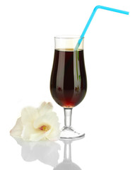 glass with cocktail and gladiolus bud isolated on white