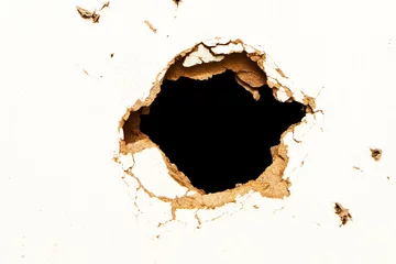 Fotobehang Hole in the fibreboard © REDPIXEL