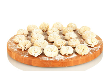 Raw Dumplings on cutting board isolated on white