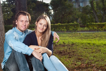 couple  sit on the grass