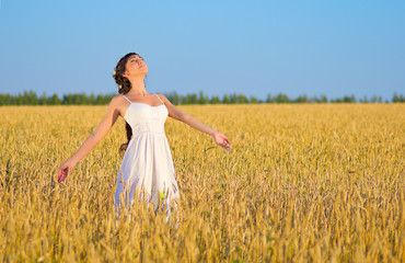 Girl on wheat field