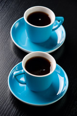 Two cups with black coffee, studio shot