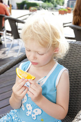 portrait of little girl with an orange