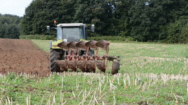 tractor plowing on autumn tillage
