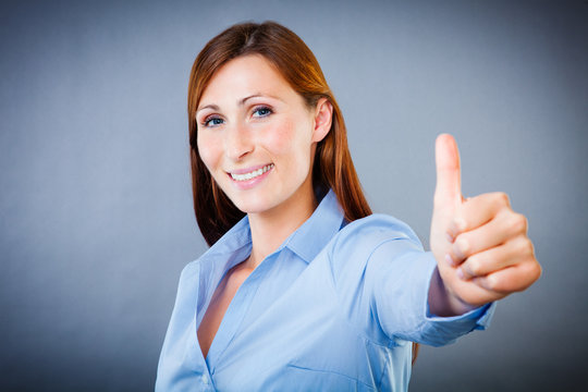 positive female business woman thumbs up