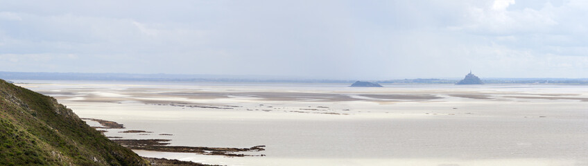Mont Saint Michel Bay at low tide with the Abbey silhouetteat th