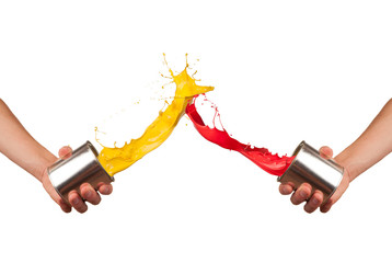 Two painters splashing pait from cans