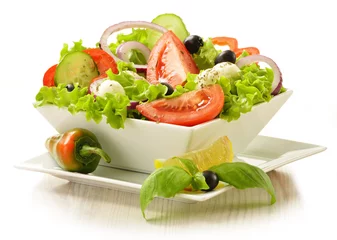 Fotobehang Vegetable salad bowl isolated on white © monticellllo