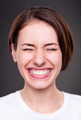 young woman is laughing loudly