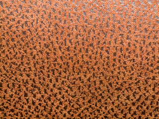 Closeup of Brown Cloth with Random Black Speckles
