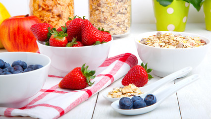 fresh blueberry and strawberry, on wooden background