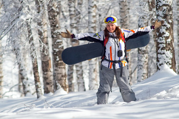 Fototapeta na wymiar Sport women going for freeride with snowboard
