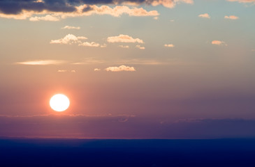 Sun at sunset cloudscape