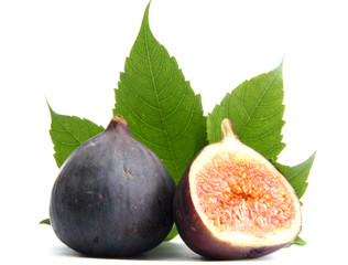 Ripe sweet figs with leaves isolated on white