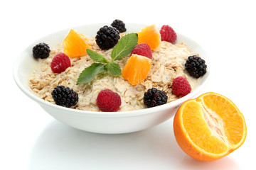 tasty oatmeal with berries, isolated on white