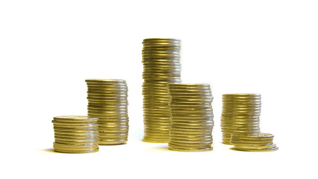 growing and reducing stacks of coins isolated on white