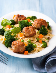Farfalle pasta with vegetables and meatballs
