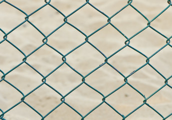 Fototapeta premium green seamless fence chain on sand background