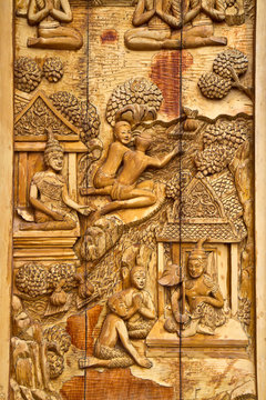 Native Thai style carving, painting on church door in the temple