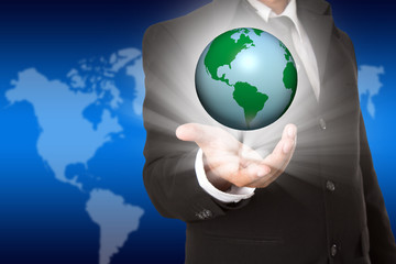 hand holding the business world