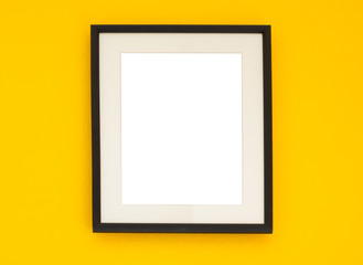 Wooden frame on the yellow wall