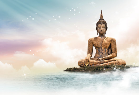 Buddha Statue Over Scenic Lighting Background