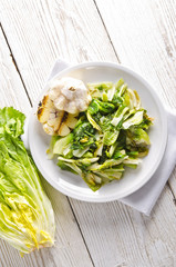 baked Romaine lettuce with garlic and pine cores