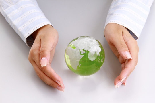 An Attractive Woman Holding A Glass Globe