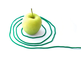 Green apple with a rope