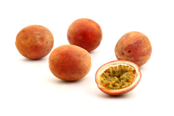 Half of passion fruit on white background