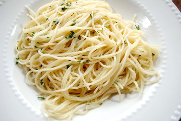 Spaghetti with Butter and Parsley on a White Plate